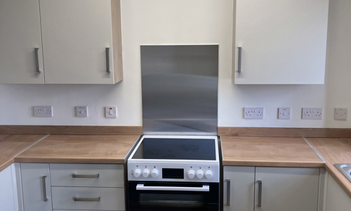 White kitchen with wood style worktops