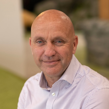 Man smiling at camera in office