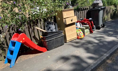 Household items lined up on a path