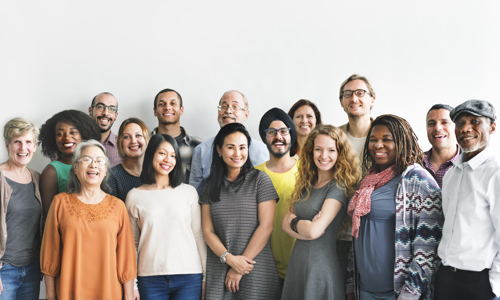 A large group of people smiling at the camera