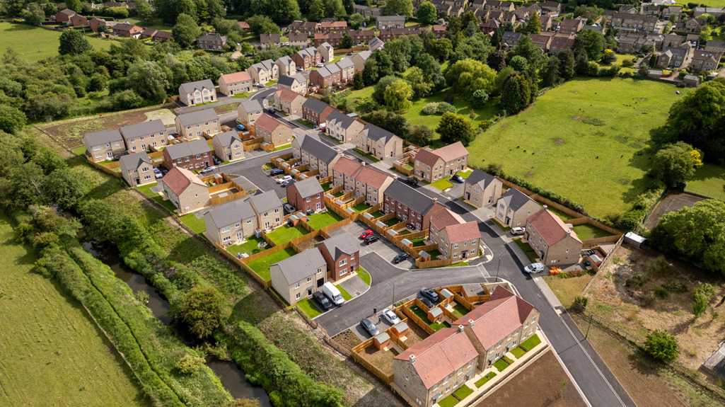 An aerial view of the Bridgewell development in Spofforth, North Yorkshire with countryside views in the background.