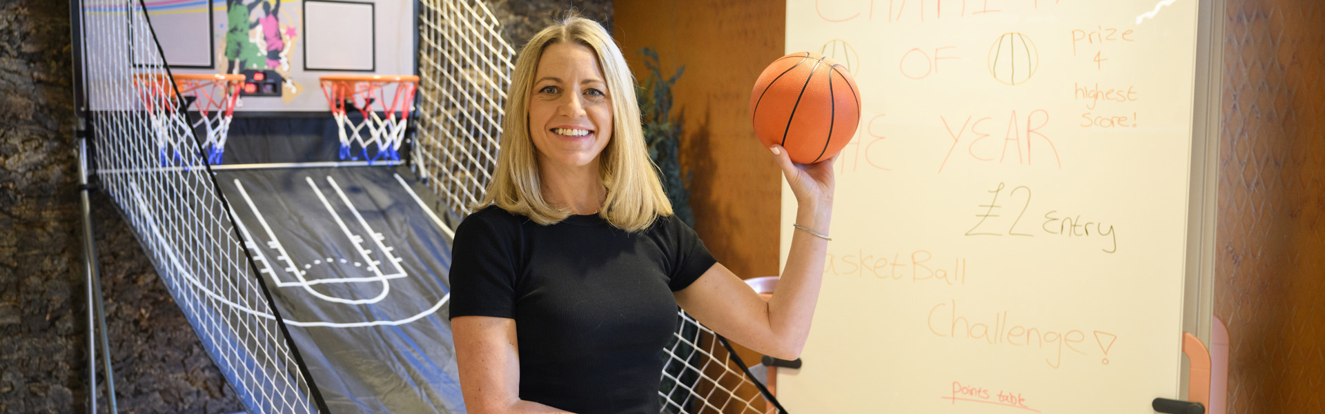 Nina at The Place holding a basketball