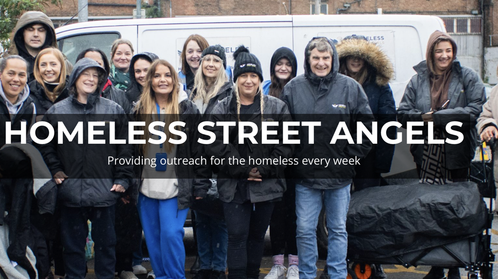 Group of volunteers standing outdoors in front of a white van during cold weather, wearing coats and hats. Overlaid text reads ‘Homeless Street Angels – Providing outreach for the homeless every week.’