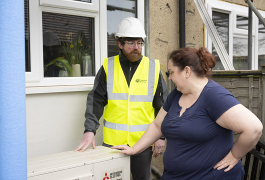 A customer with Yorkshire Housing staff outside a property