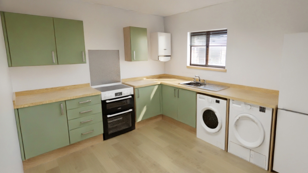 Image of a green kitchen with wood effect worktops