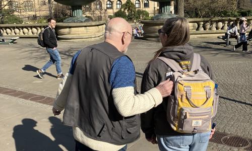 Two people walking in Sheffield city centre
