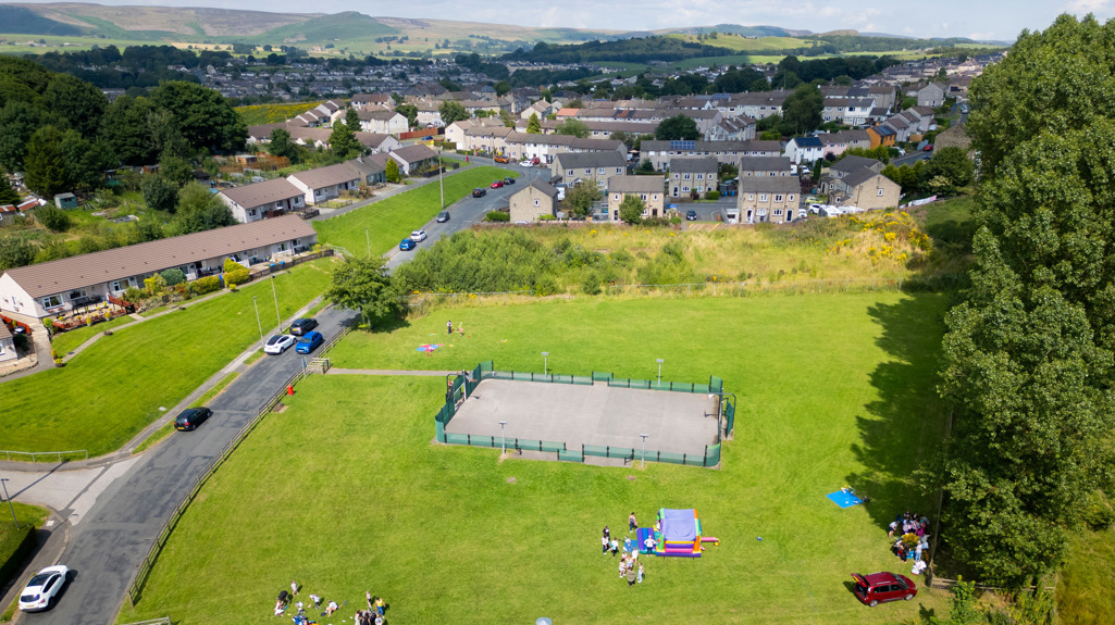 Drone picture above the Skipton community centre on Greatwood showing a family fun day on the grass