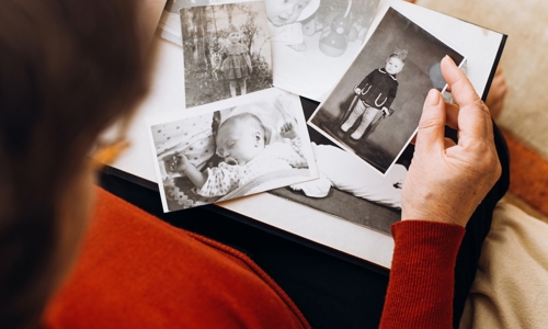 Someone looking at old black and white photographs