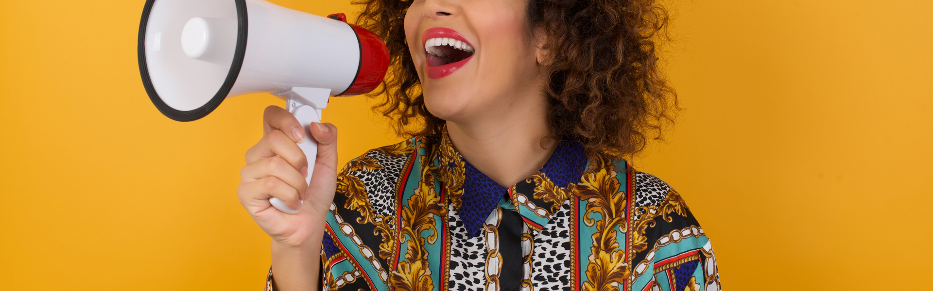 Young woman using megaphone