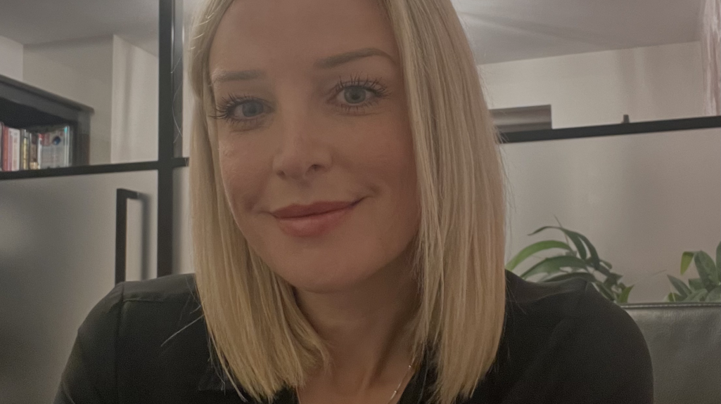 A headshot of Sarah